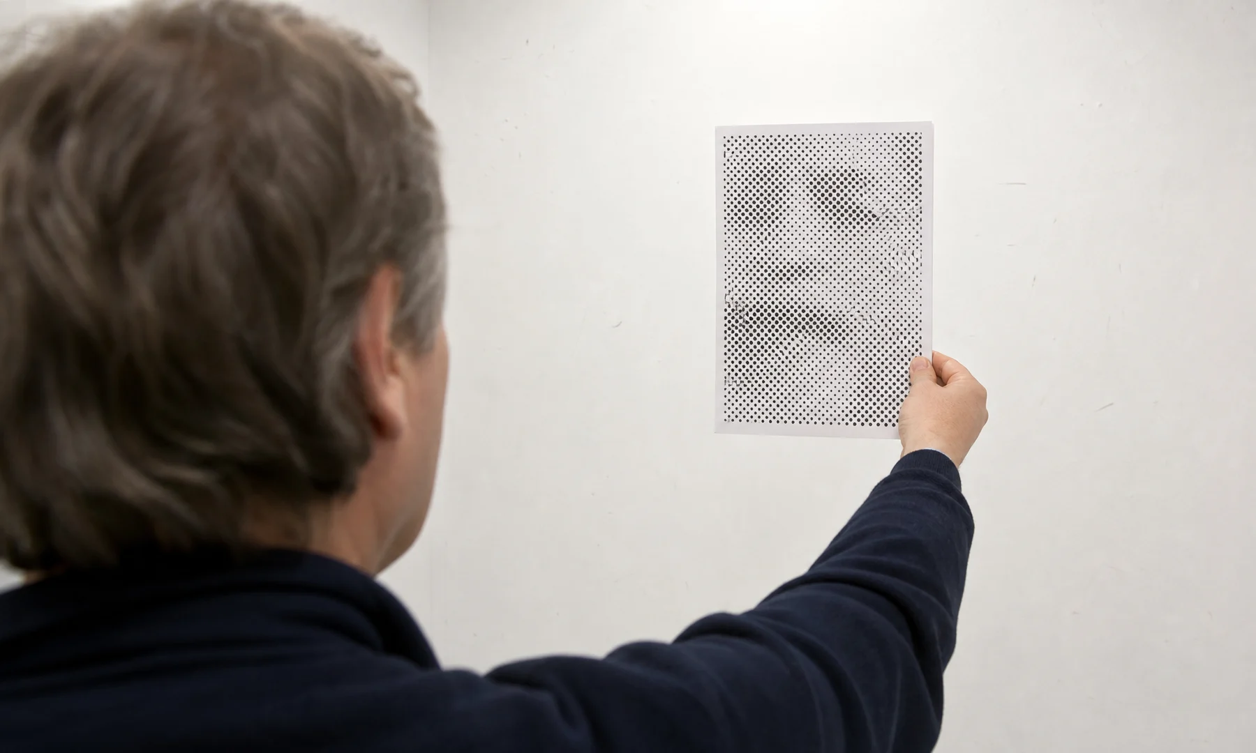 A tiled PDF export preview showing a halftone poster split across printable pages.
